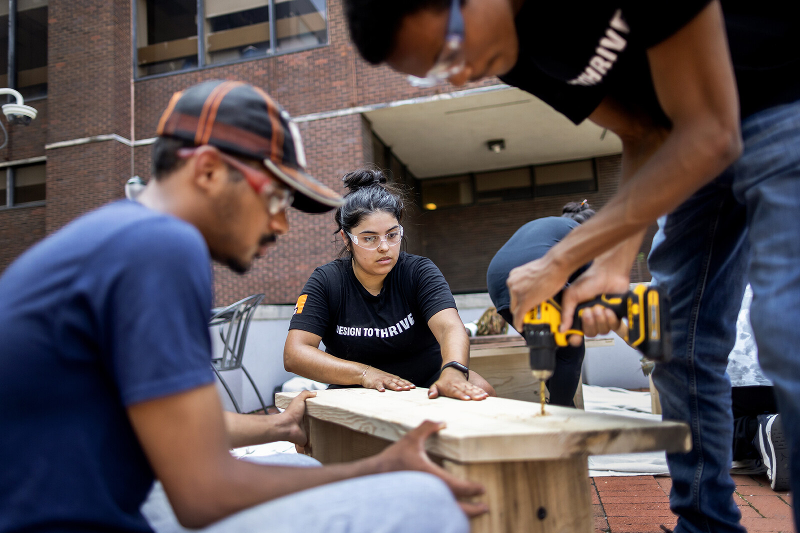 students working with projects for progress